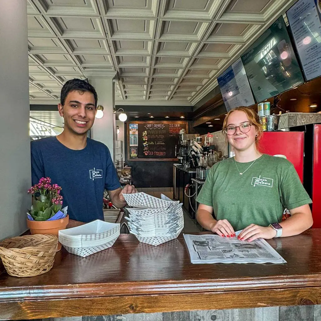 Employees smiling while doing prep work